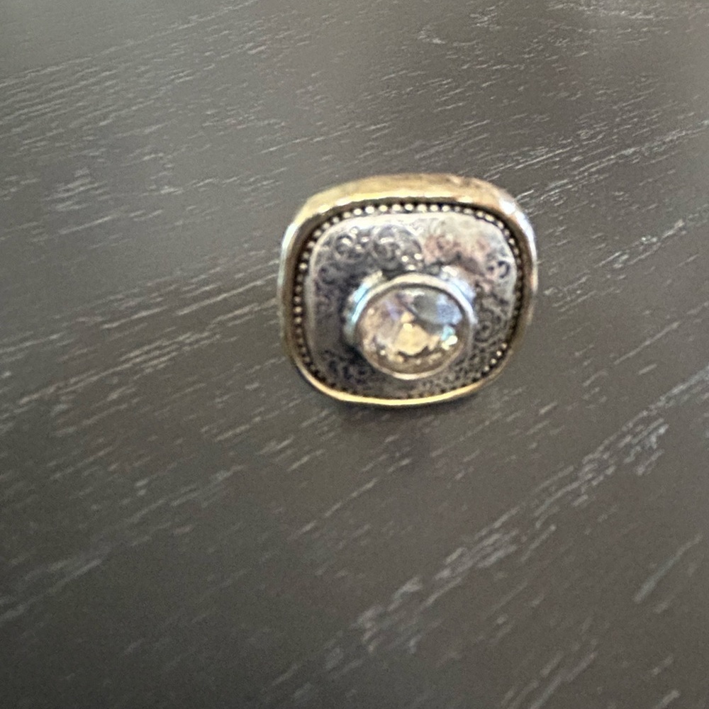 Chico’s costume ring. Pounded silver and gold with center crystal size 9